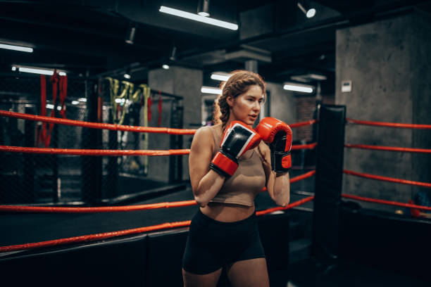 istock Focused boxer honing her skills in the ring 2172860415