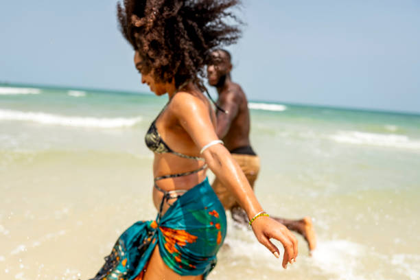 istock Joyful Couple Running Along the Beach Shoreline 2172861234