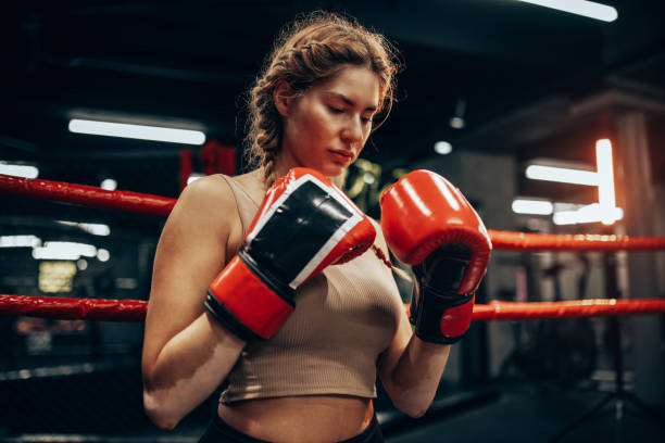 istock Boxer in gloves contemplating next move, ring side 2172864220