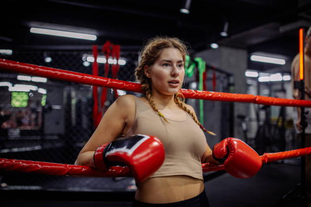 istock Boxer resting against ropes with intense gaze 2172865782