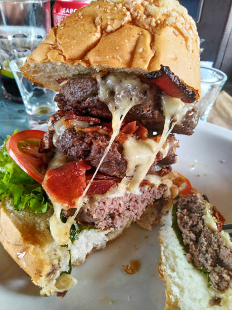 istock A massive, delicious burger packed with layers of flavor. 2172866887