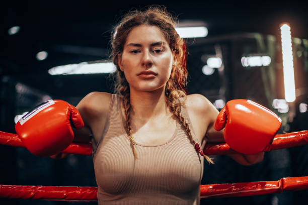 istock Confident woman boxer in boxing ring with gloves. 2172869188