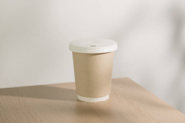 istock This mock-up showcases a paper cup designed for takeaway hot coffee or hot drinks, emphasizing convenience and sustainability. 2172872643