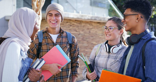 istock Students, university and outdoor on campus for conversation, talking and share knowledge on module. People, friends and outside for group project discussion, study and together for college gossip 2172873331