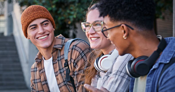 istock Students, college and outdoor on campus for conversation, talking and share knowledge on module. People, friends and outside for group project discussion, speaking and together for university gossip 2172873445