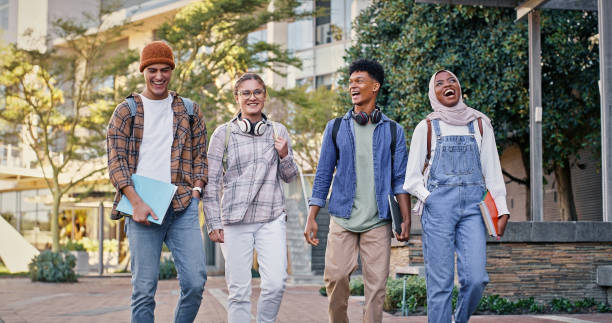 istock Students, walking and outdoor on campus for conversation, talking and share knowledge on module. People, friends and outside for group project discussion, study lesson and together for trip to class 2172873493