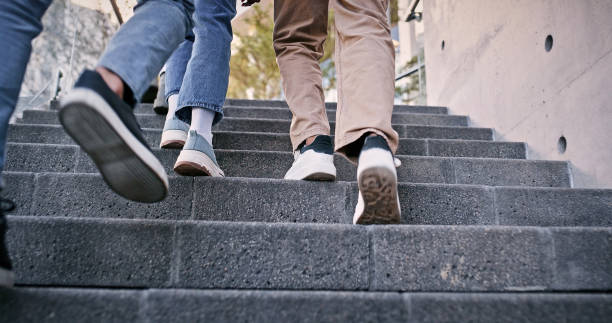istock Feet, students and walking on steps at school for education, learning break and studying of classroom lesson. People, legs and stairs for knowledge, university and travel for morning path outdoor 2172873559