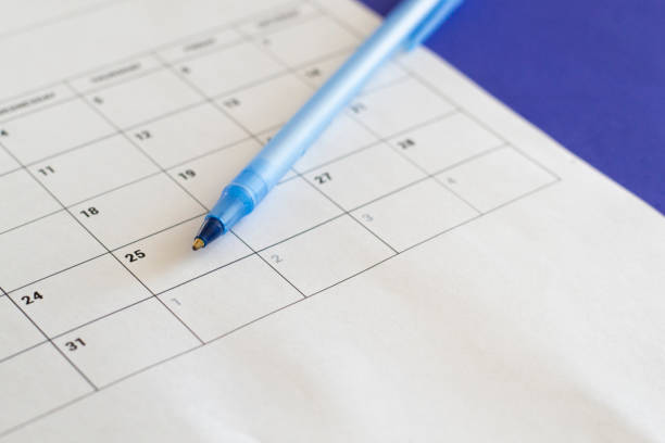 pen on calendar page background business planning appointment meeting concept