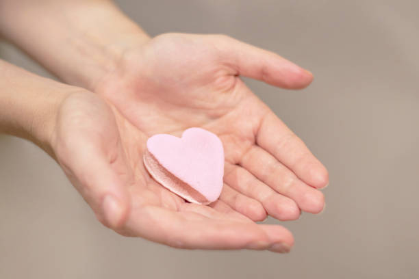 istock Female hands with heart of marshmallow 2172876323
