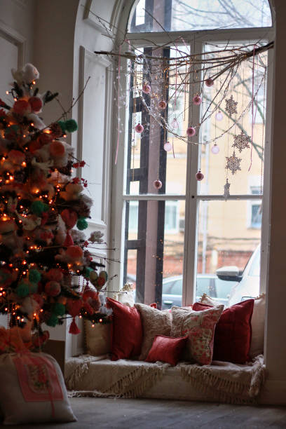 istock winter window decoration with cushions and Christmas decor in pink colors 2172881118
