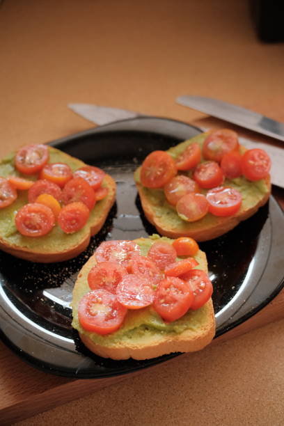 istock Avocado toast with cream and cherry tomatoes 2172882280