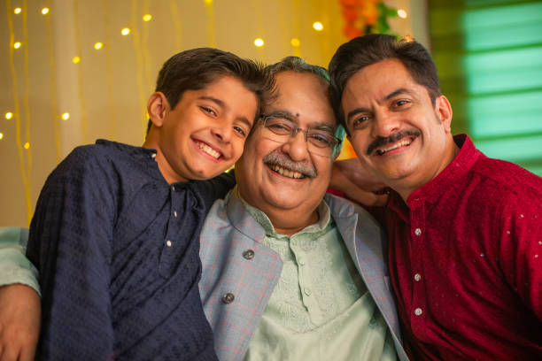 istock Happy multi-generation family sitting on sofa at home during Diwali 2172882360