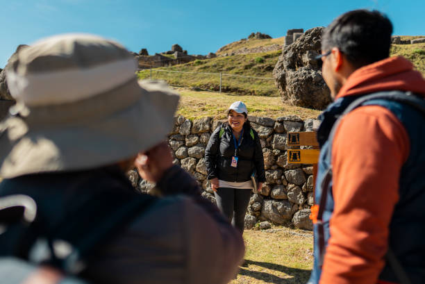 istock Tour guide woman talking with tourists in Cusco, Peru 2172883319