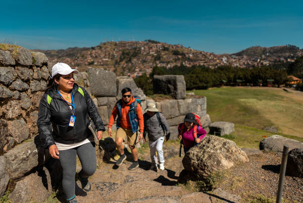 istock Tour guide woman walking with turists on Cusco, Peru 2172883489