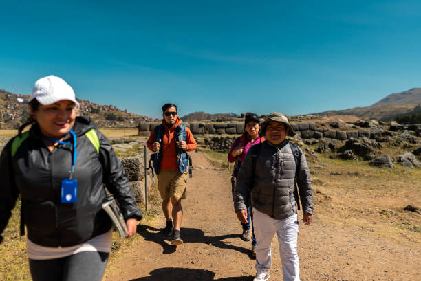 istock Traveler friends walking with tour guide on Cusco, Peru 2172883665