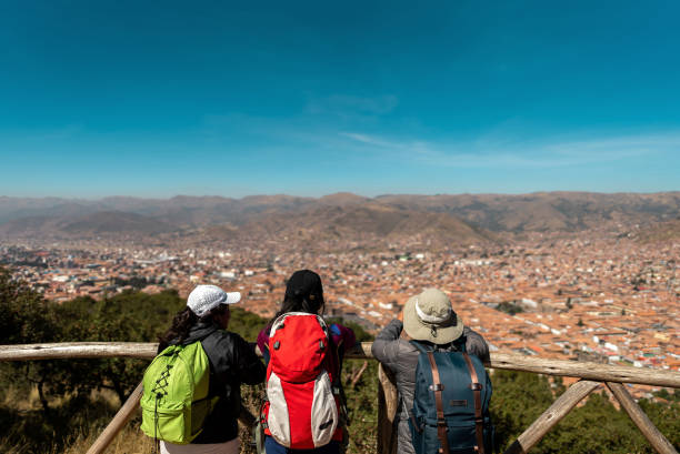 Traveler friends looking at view on Cusco, Peru