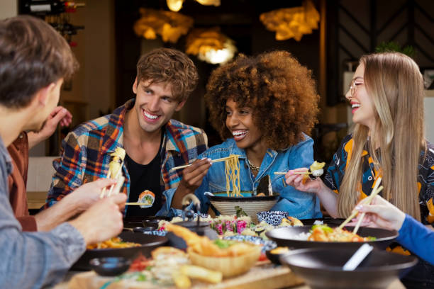 istock Group of friends enjoying dinner in restaurant 2172886042