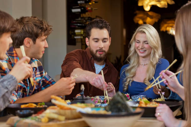 istock Group of friends enjoying dinner in restaurant 2172886185