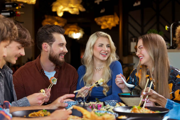 istock Group of friends enjoying dinner in restaurant 2172886454