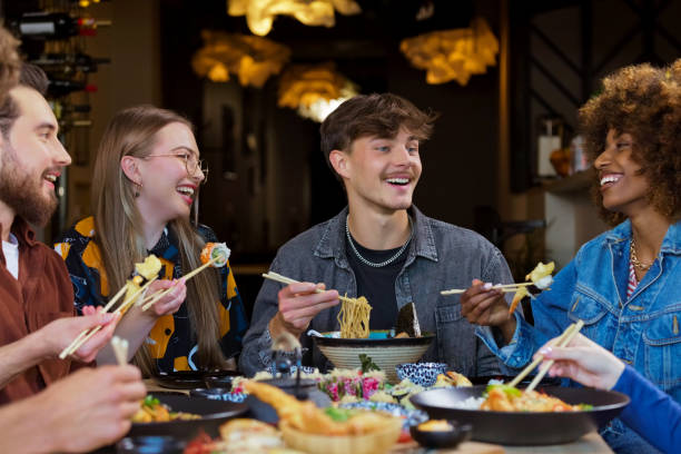 istock Group of friends enjoying dinner in restaurant 2172886627