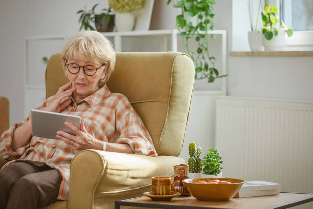 istock Worried senior woman using digital tablet 2172889521
