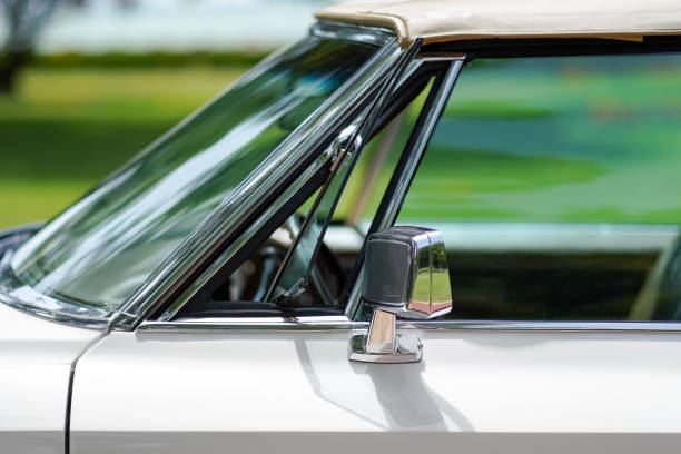 Close up of 1968 Cadillac vent window (wing window, quarter glass, quarter light) and mirror. Palic, Serbia, 30.06.2024