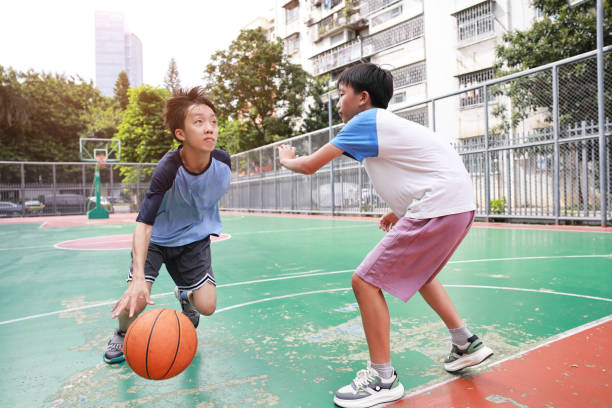 istock Two boys playing basketball 2172893677