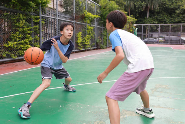 istock Two boys playing basketball 2172894046