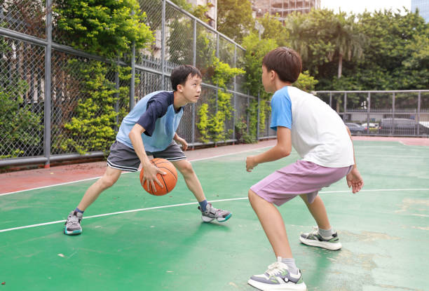istock Two boys playing basketball 2172894051