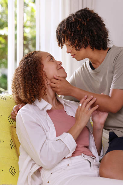 istock Couple flirting on sofa 2172894630