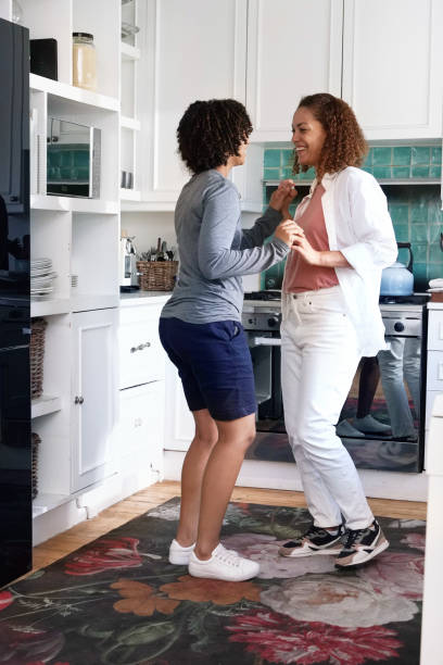 istock Couple holding hands in kitchen 2172894649