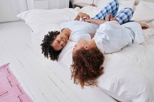 istock Couple relaxing on bed 2172895004