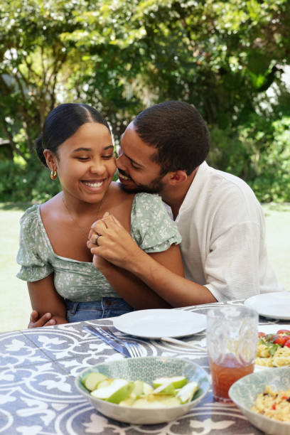 istock Couple flirting at table on patio 2172895032