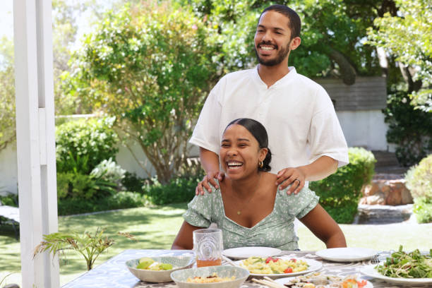 istock Smiling couple at table on patio 2172895040