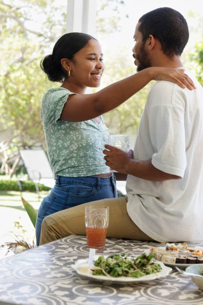 istock Smiling couple flirting in garden 2172895296
