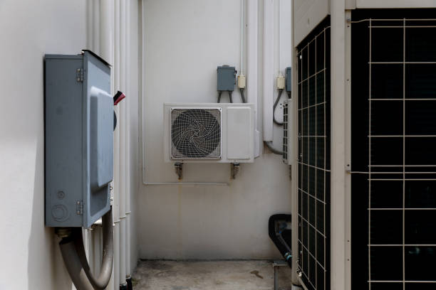 istock Air conditioner compressor installed in old building. Outdoor split wall type air conditioner compressor unit inverter installed on the outside of the building. Air conditioner compressor outdoor unit 2172898803