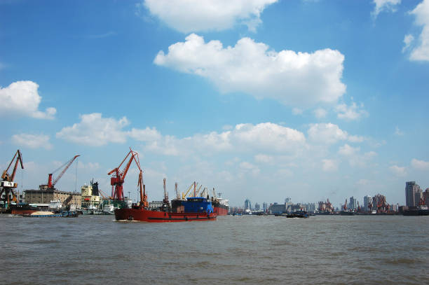 High angle view of industrial ships on the Huangpu river by the Bund, Shanghai, China.