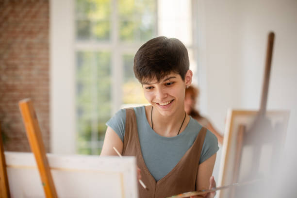 istock Smiling young artist finds joy in artistic process. 2172899226