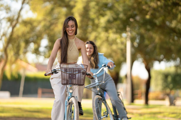 istock Women riding bikes and having fun 2172901351