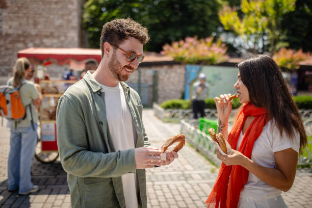 istock Friends eating bagels in outdoor setting 2172903758