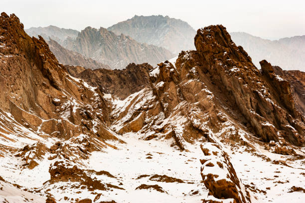 Salt Lake Valley rocky mountains covered with snow, Ku Che County, Xinjiang, China