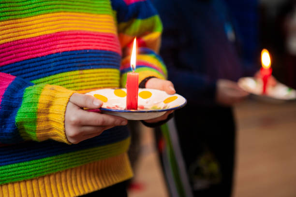 istock Children holding lighted candles during a ritual in school 2172903856