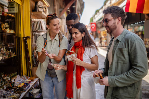 istock Group examining unique items at a souvenir shop 2172905668