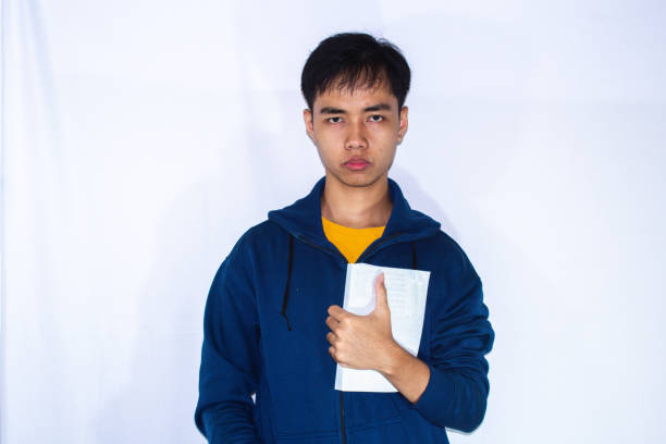 istock asian teenager with book 2172908291