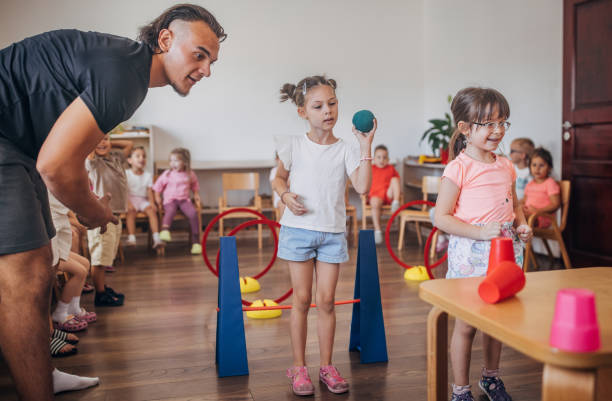 istock Young children enjoy a fun and challenging obstacle course 2172909810