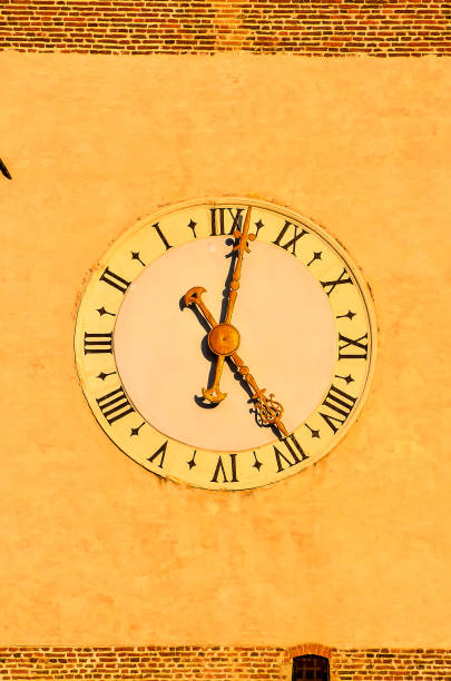 istock A clock with Roman numerals on it shows the time as 10:30 2172913655