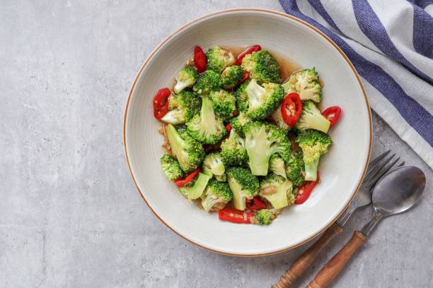 istock Homemade Stir fried broccoli  in cream ceramic plate on grey cement  table background,Vegetarian food 2172925820