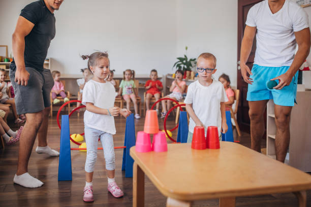 istock Kids participating in indoor group activities togther 2172931618