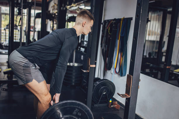 istock Man preparing for barbell deadlift exercise in gym 2172934998
