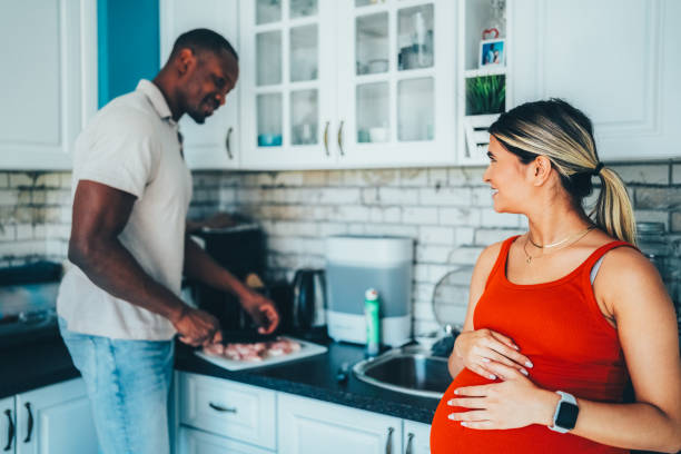 istock Man cooking for his pregnant wife 2172939092